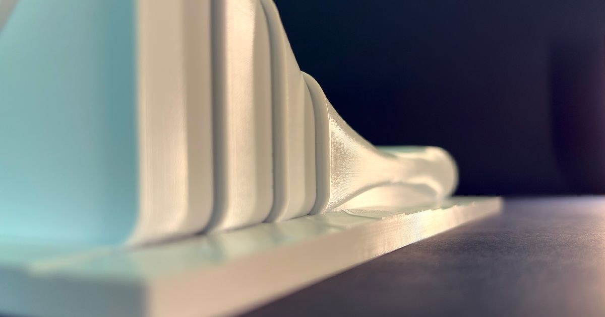 Heydar Aliyev Center 3D model printing on FDM printer bed — graphic design by Adrian Martinez
