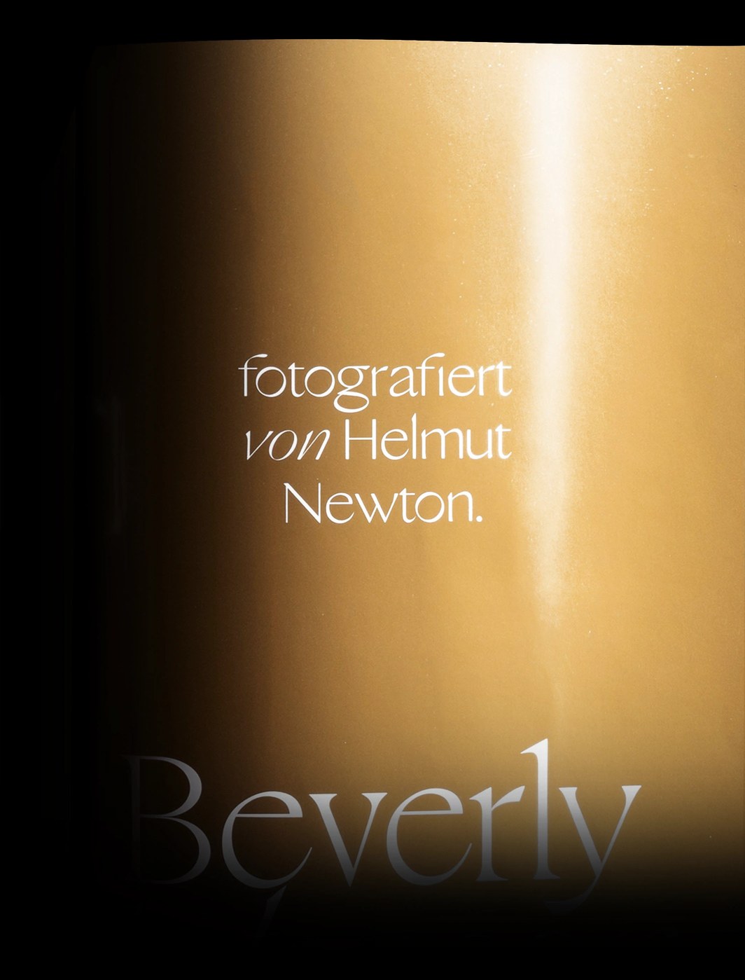 sans serif typeface detail close up on gold paper