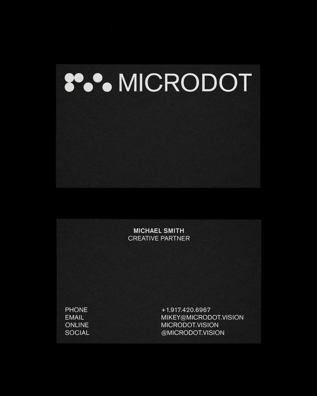 Microdot brand identity business cards with cinematic edge codes