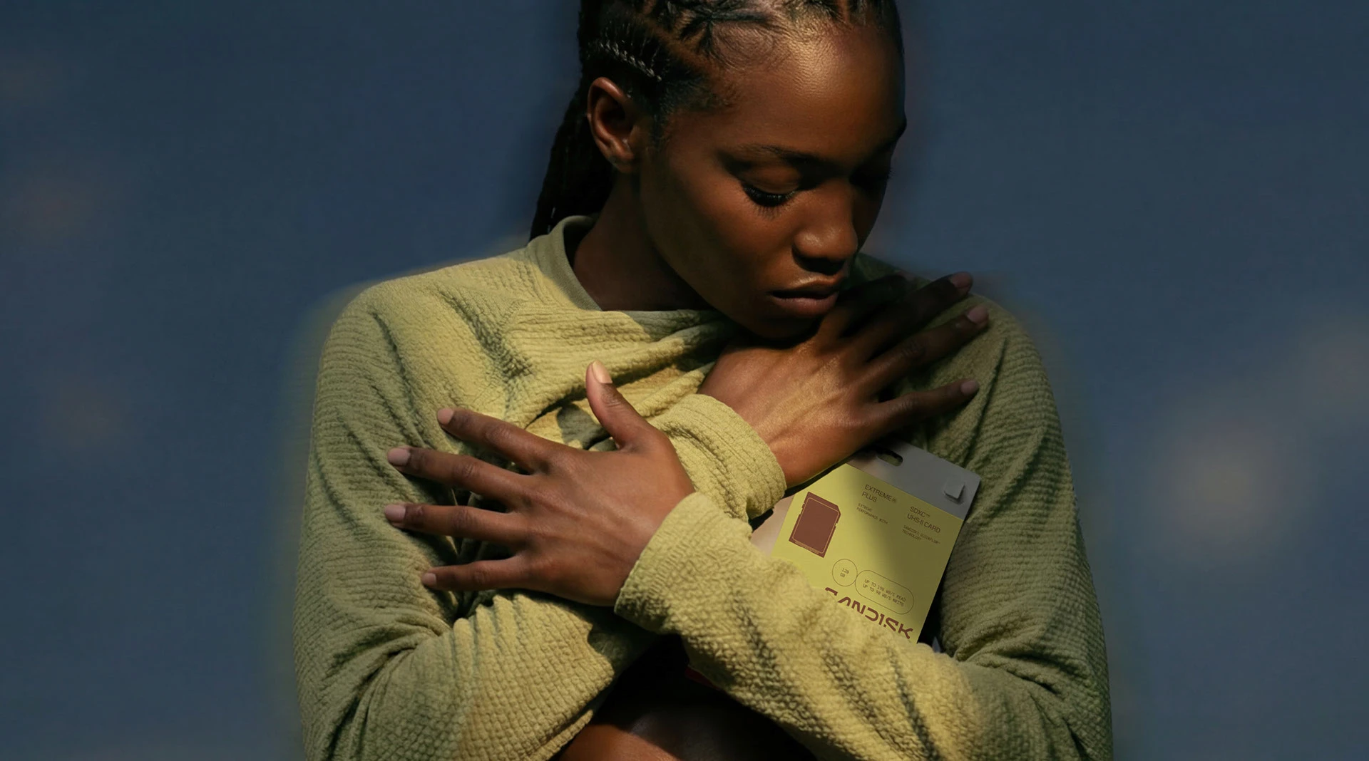 SanDisk packaging design system hero — stacked boxes in black with neon yellow-green accent