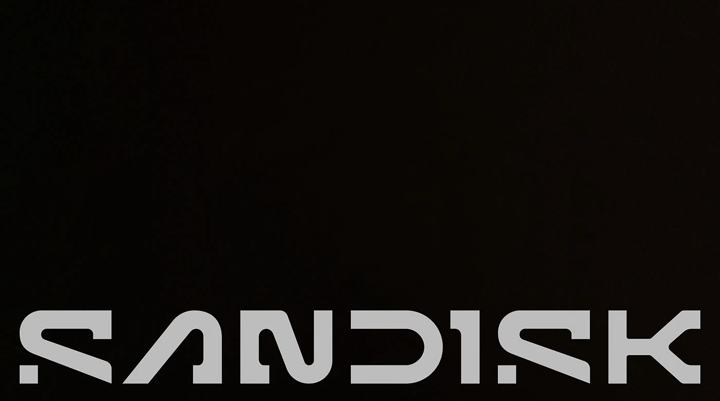 SanDisk packaging design system — SSD box with matte black ground and full-width wordmark