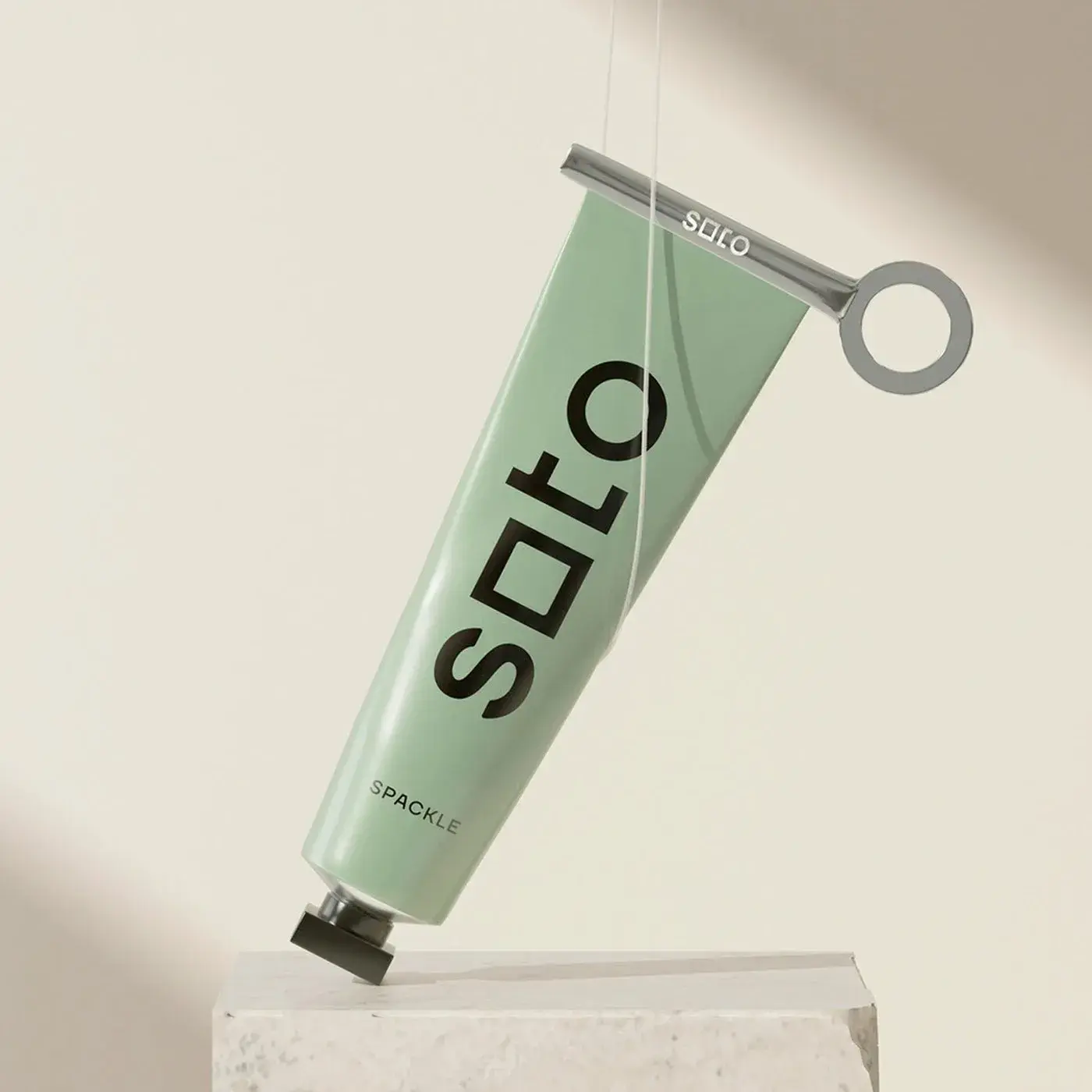 Soto branding wordmark in dark charcoal on sage green — first 'o' as a square, last 'o' as a circle