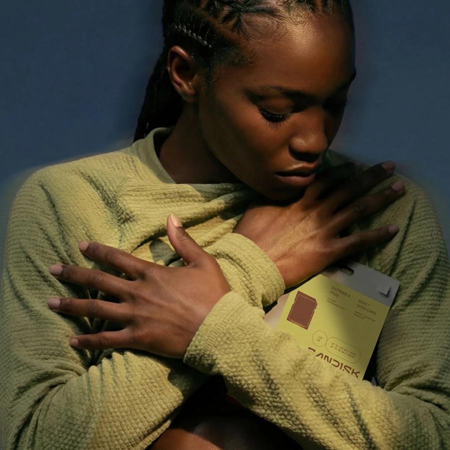 SanDisk packaging design system hero — stacked boxes in black with neon yellow-green accent